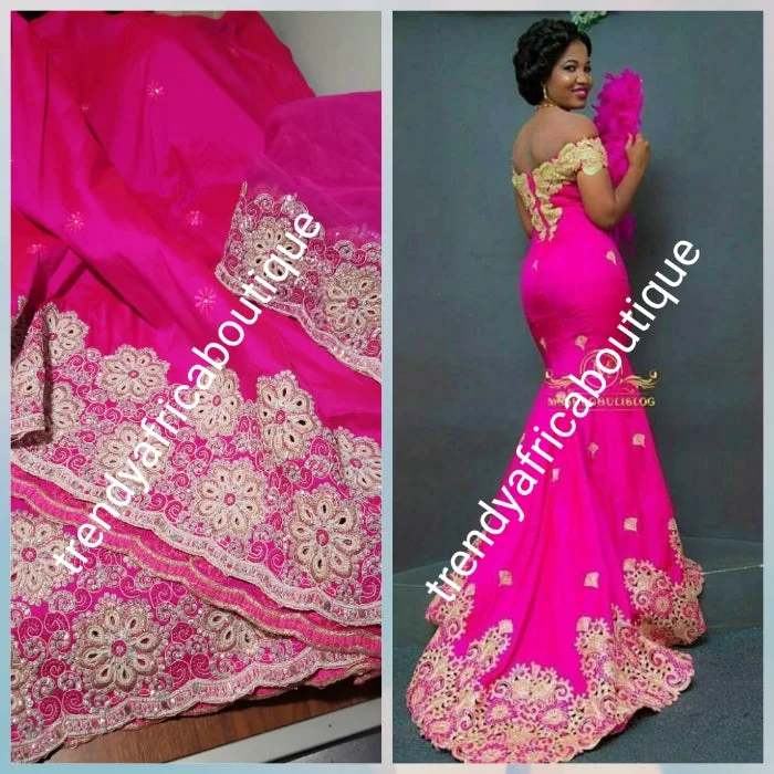 Sale: New arrival Nigerian Tranditional wedding George wrapper. Embellished with quality dazzling beads/crystal stones. Classic fuschia pink. Full 5yds + 1.8yds matching blouse + free headtie. Indian-George. Model shown wearing similar fabric Chic Off-Shoulder Blouse Sale: New arrival Nigerian Tranditional wedding George wrapper. Embellished with quality dazzling beads/crystal stones. Classic fuschia pink. Full 5yds + 1.8yds matching blouse + free headtie. Indian-George. Model shown wearing similar fabric Chic Off-Shoulder Blouse