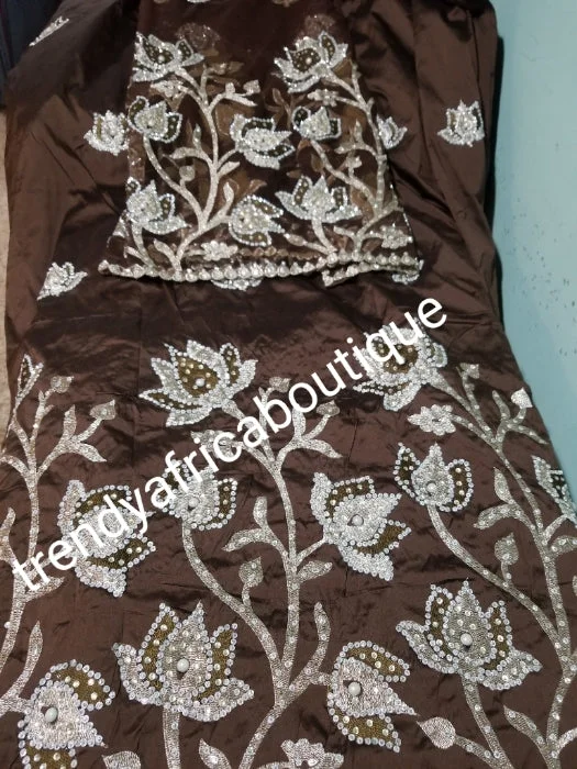 New arrival: Nigerian Traditional Silk embroidery George wrapper. Quality embroidery + Hand Beaded/stones design in coffee brown 5yds + 1.8 matching net blouse. Igbo/delta bride outfit. Small-George. Ruffled Neck Blouse New arrival: Nigerian Traditional Silk embroidery George wrapper. Quality embroidery + Hand Beaded/stones design in coffee brown 5yds + 1.8 matching net blouse. Igbo/delta bride outfit. Small-George. Ruffled Neck Blouse