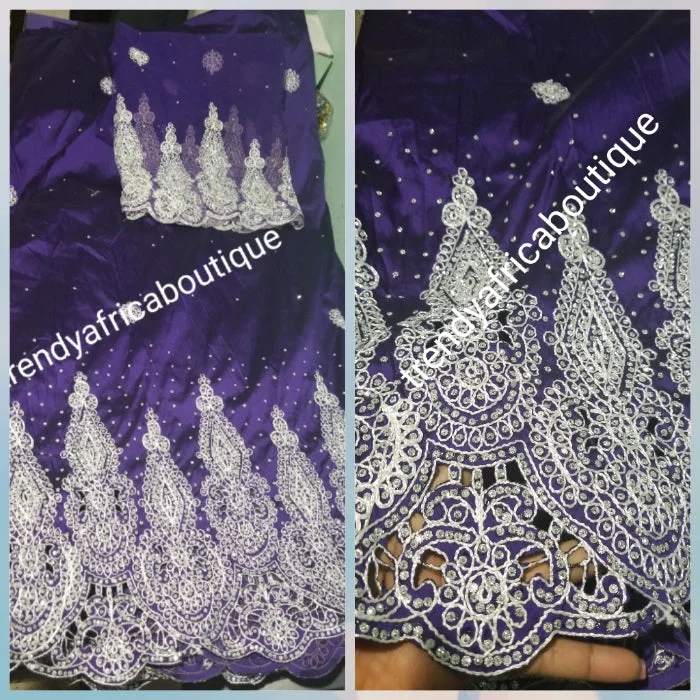 Original quality taffeta George wrapper. beautiful Purple embrioded and all over crystal stones Wrapper in 5yds + 1.8yds net for blouse. dazzling crystal stones to perfection. Small-George. Model wearing similar George. Use for Nigerian weddings and more Chic Sleeveless Blouse Original quality taffeta George wrapper. beautiful Purple embrioded and all over crystal stones Wrapper in 5yds + 1.8yds net for blouse. dazzling crystal stones to perfection. Small-George. Model wearing similar George. Use for Nigerian weddings and more Chic Sleeveless Blouse
