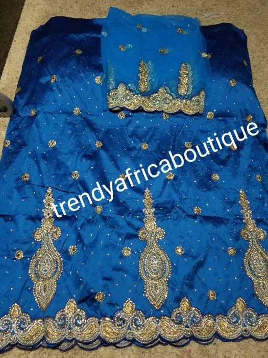 SALE,SALE- New arrival Nigerian Tranditional wedding George wrapper. Embellished with quality dazzling beads/crystal stones design in beautiful Turquoise blue. Full 5yds + 1.8yds matching blouse + free headtie. Indian-George. Mandarin Collar Blouse SALE,SALE- New arrival Nigerian Tranditional wedding George wrapper. Embellished with quality dazzling beads/crystal stones design in beautiful Turquoise blue. Full 5yds + 1.8yds matching blouse + free headtie. Indian-George. Mandarin Collar Blouse