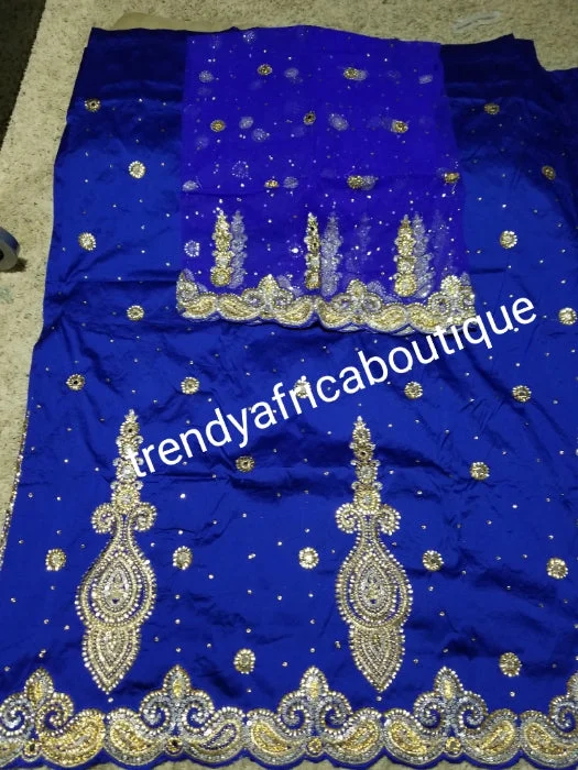 SALE,SALE- New arrival Nigerian Traditional wedding George wrapper. Embellished with quality dazzling beads/crystal stones design in royal blue. Full 5yds + 1.8yds matching blouse. Indian-George. Modern Oversized Blouse SALE,SALE- New arrival Nigerian Traditional wedding George wrapper. Embellished with quality dazzling beads/crystal stones design in royal blue. Full 5yds + 1.8yds matching blouse. Indian-George. Modern Oversized Blouse