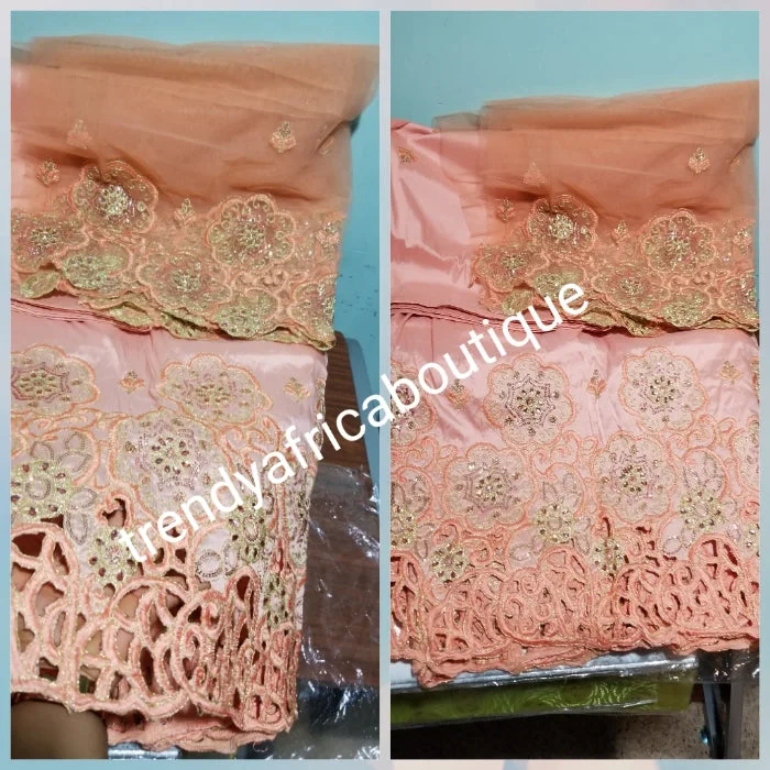Latest design Indian-George wrapper. Embriodery peach silk george with crystal stones on hand cut border. 5yd+ 1.8yds matching blouse. Lustrous quality. Aso-ebi George. Need to order for group, contact us directly Frilled Cuff Blouse Latest design Indian-George wrapper. Embriodery peach silk george with crystal stones on hand cut border. 5yd+ 1.8yds matching blouse. Lustrous quality. Aso-ebi George. Need to order for group, contact us directly Frilled Cuff Blouse