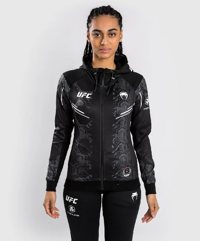 UFC Adrenaline by Venum Authentic Fight Night Women’s Walkout Hoodie - Black Hoodie with Velcro Closure Adjustable Secure UFC Adrenaline by Venum Authentic Fight Night Women’s Walkout Hoodie - Black Hoodie with Velcro Closure Adjustable Secure